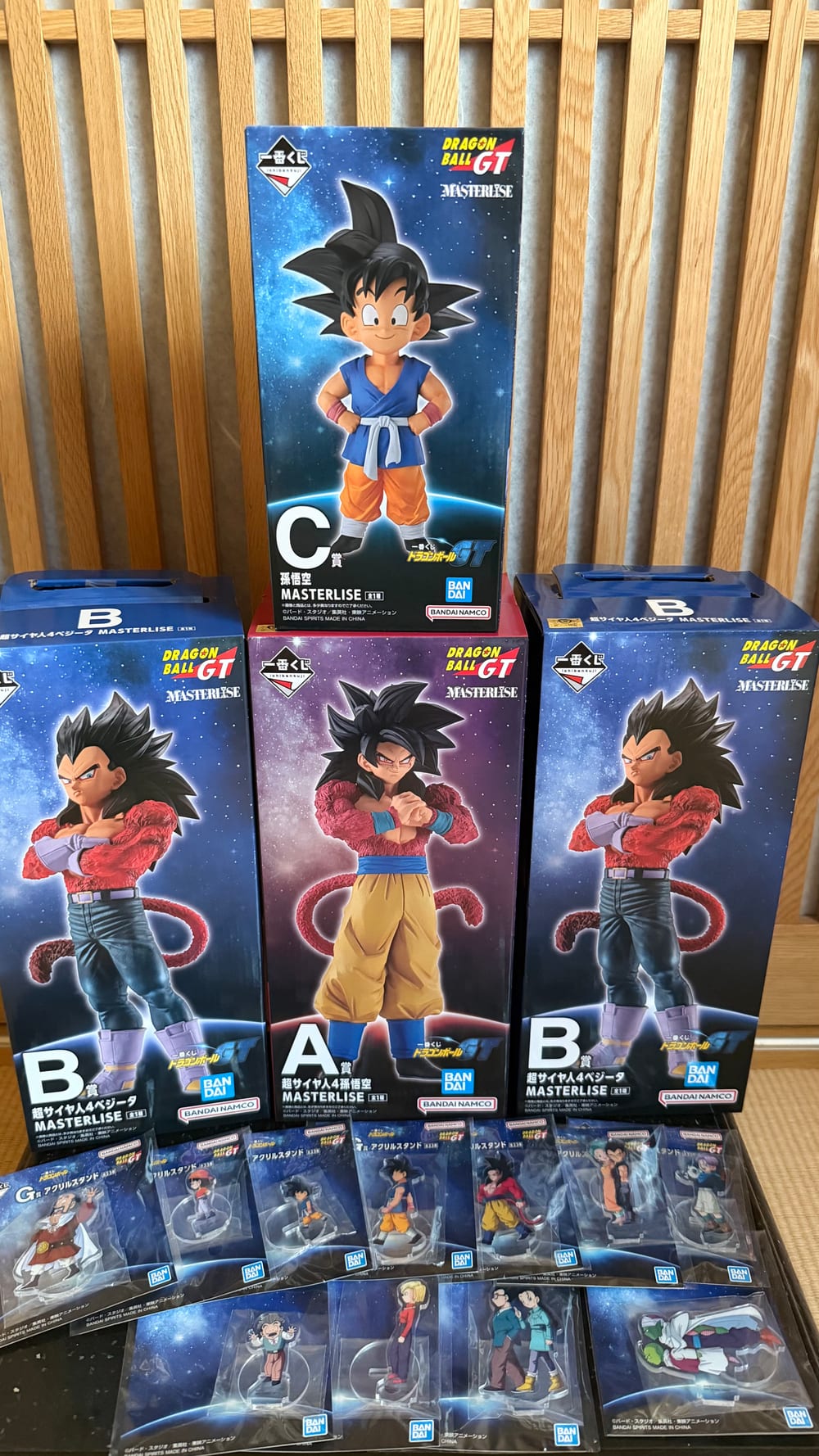 The A, B and C prize figures from a Dragon Ball GT ichiban kuji standing in a row